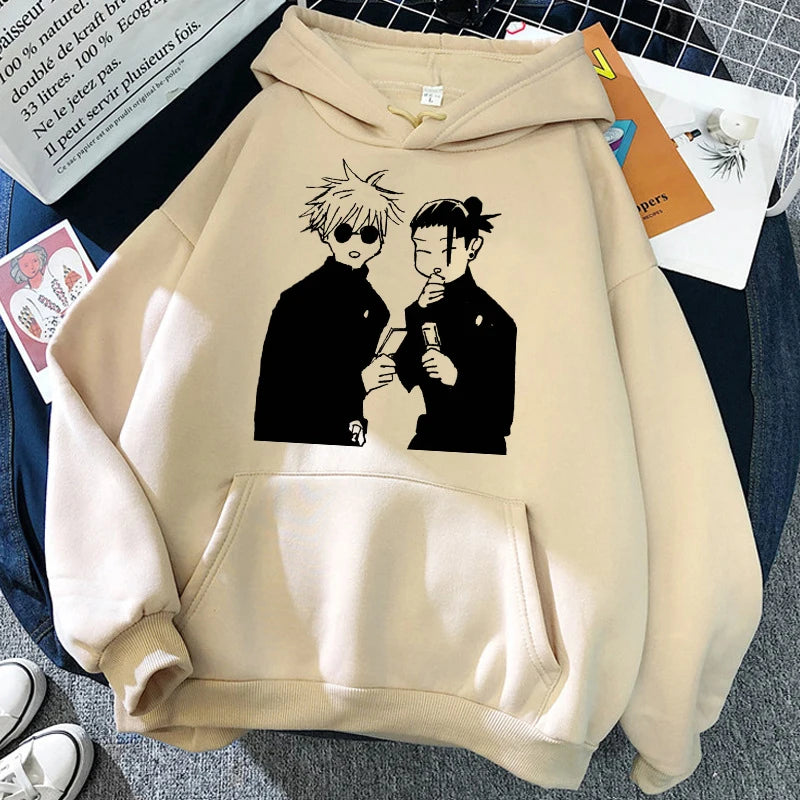 Sweat à capuche beige avec poche kangourou et imprimé de personnages sur le devant