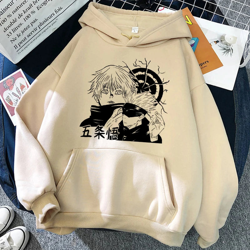 Sweat à capuche beige, imprimé noir visage encadré par des lignes et symboles.