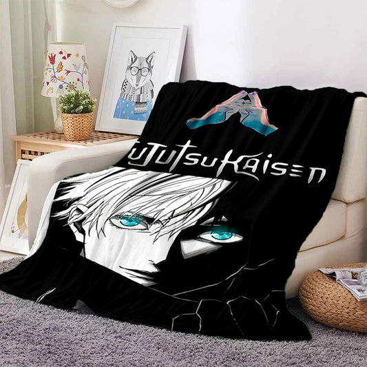 Plaid Jujutsu Kaisen Icône Gojo : couverture noire en tissu doux avec visages anime bleu-vert et texte décoratif